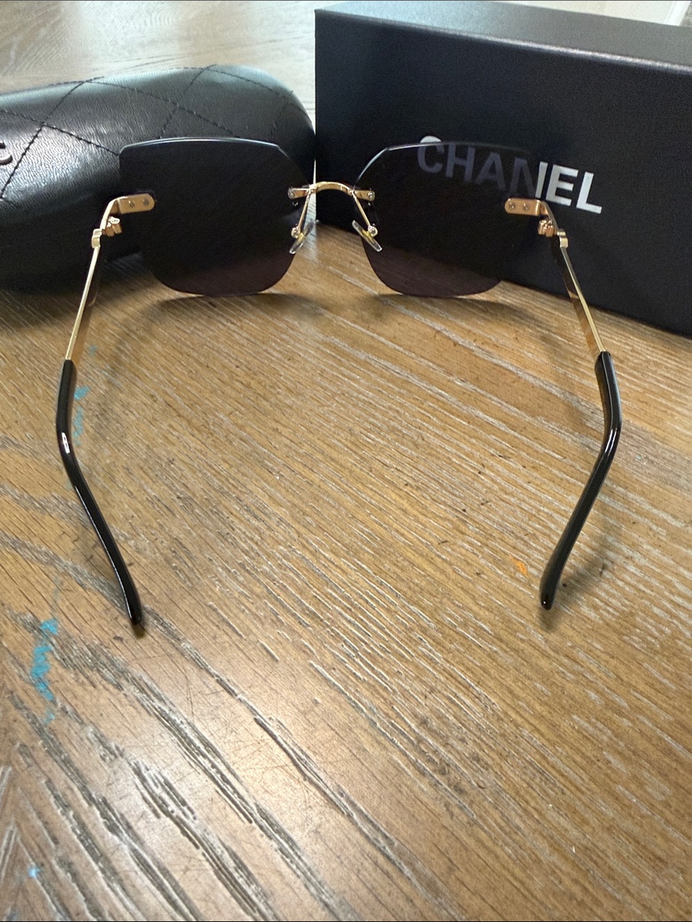 CHANEL Rimless Square Sunglasses in Black and Gold Accents - Picture 9 of 10